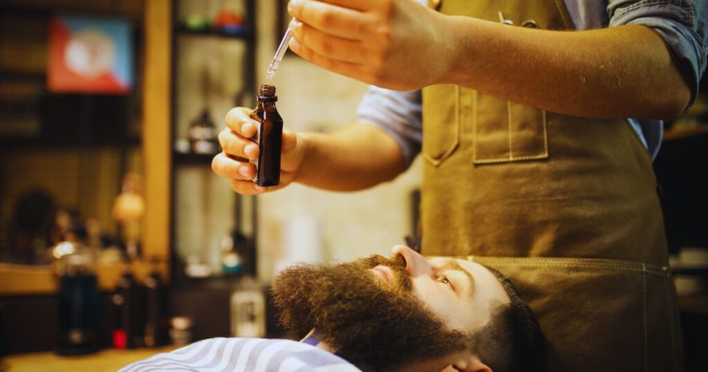 Beard oil, boar bristle brush, and wooden comb for beard itch relief